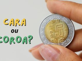 cara ou coroa mao segurando moeda
