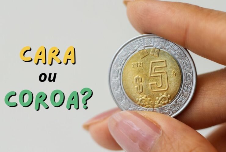 cara ou coroa mao segurando moeda